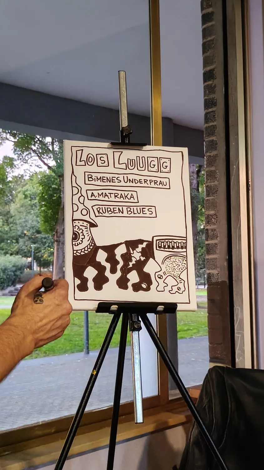 Cartel de la noche pintado en directo durante el concierto